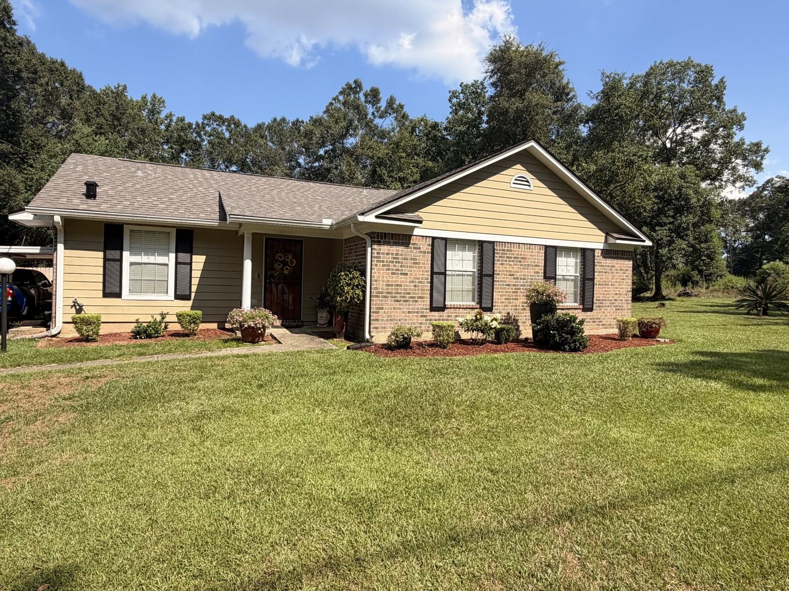 Finished FORTIFIED roof on a tan brick home